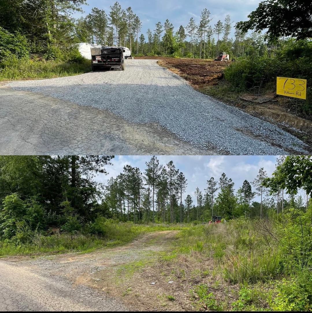 Gravel road construction progress in a forested area with equipment visible.